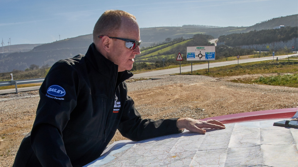 Driver using a map for directions